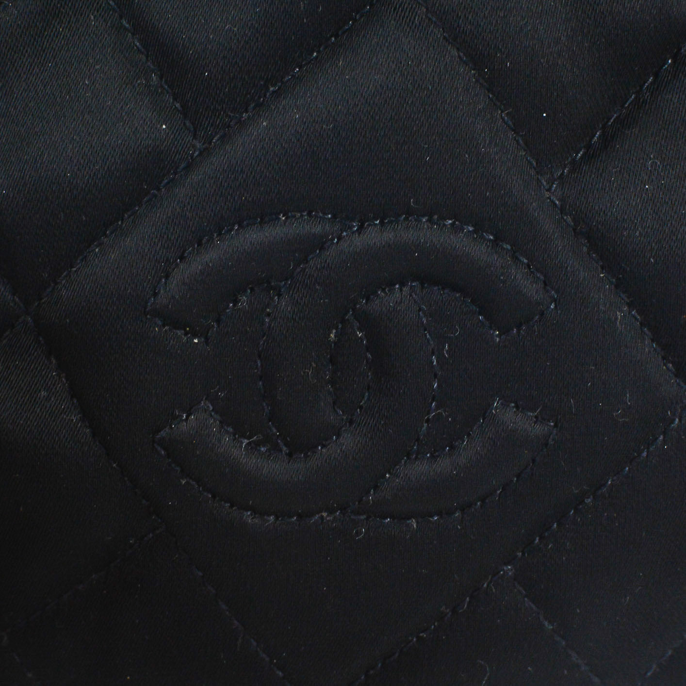 CHANEL Round Quilted Satin Mini Tassel Crossbody